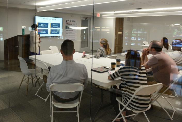 Participants listen to presentation on mindfulness