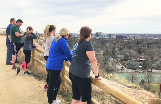 Employees look out over downtown Boise from Camel's Back Park