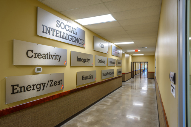 Hallway inside a charter school with character traits on the wall.